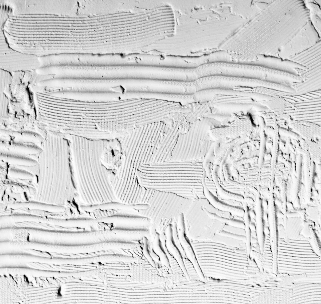 Photographie d'un mur en plâtre : différentes texture et perception tactile